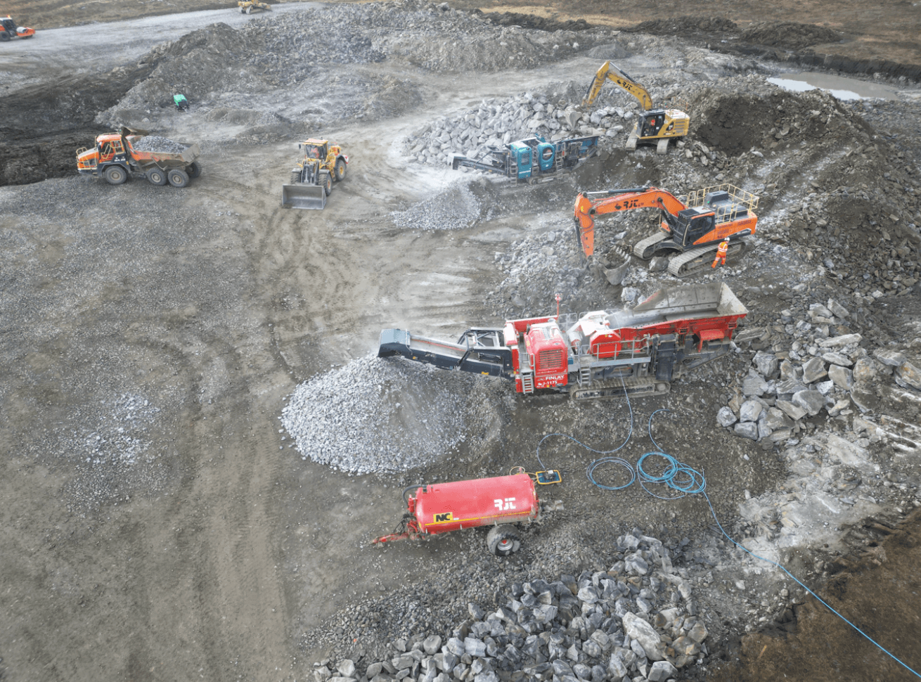 Story Contracting site aerial site photo showing aggregates piles.