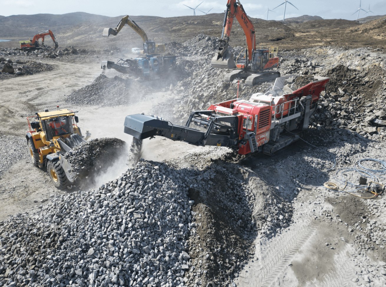 Story Contracting site aerial site photo showing an earth mover and aggregates.